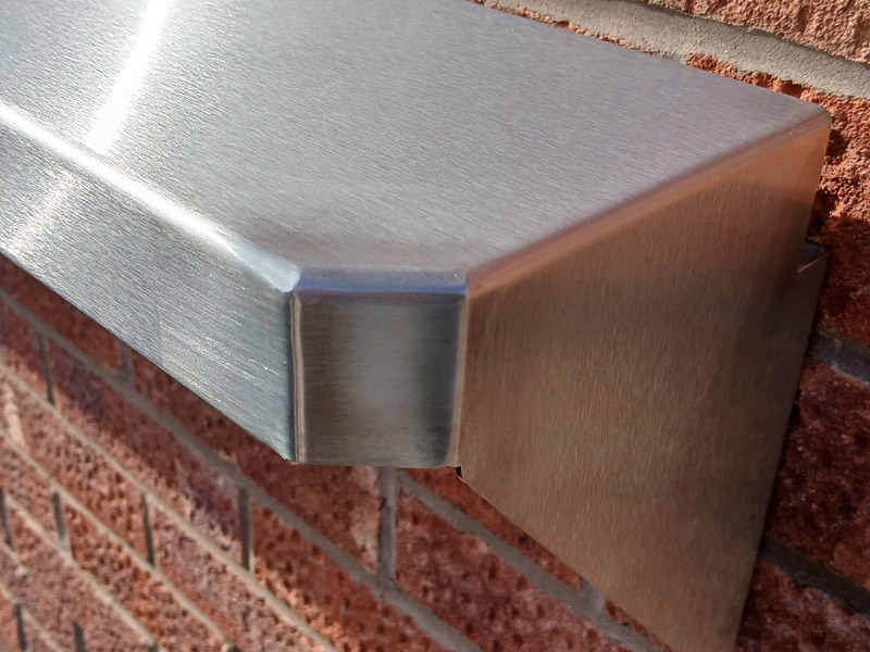 Corner detail showing stainless steel chamfered and radiused safety corners