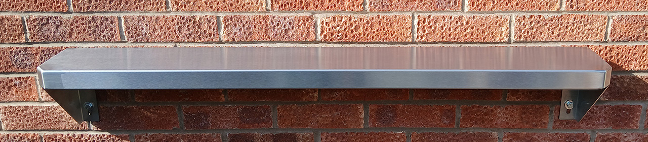 120cm (4') Stainless Steel Stadium shelving bolted to wall